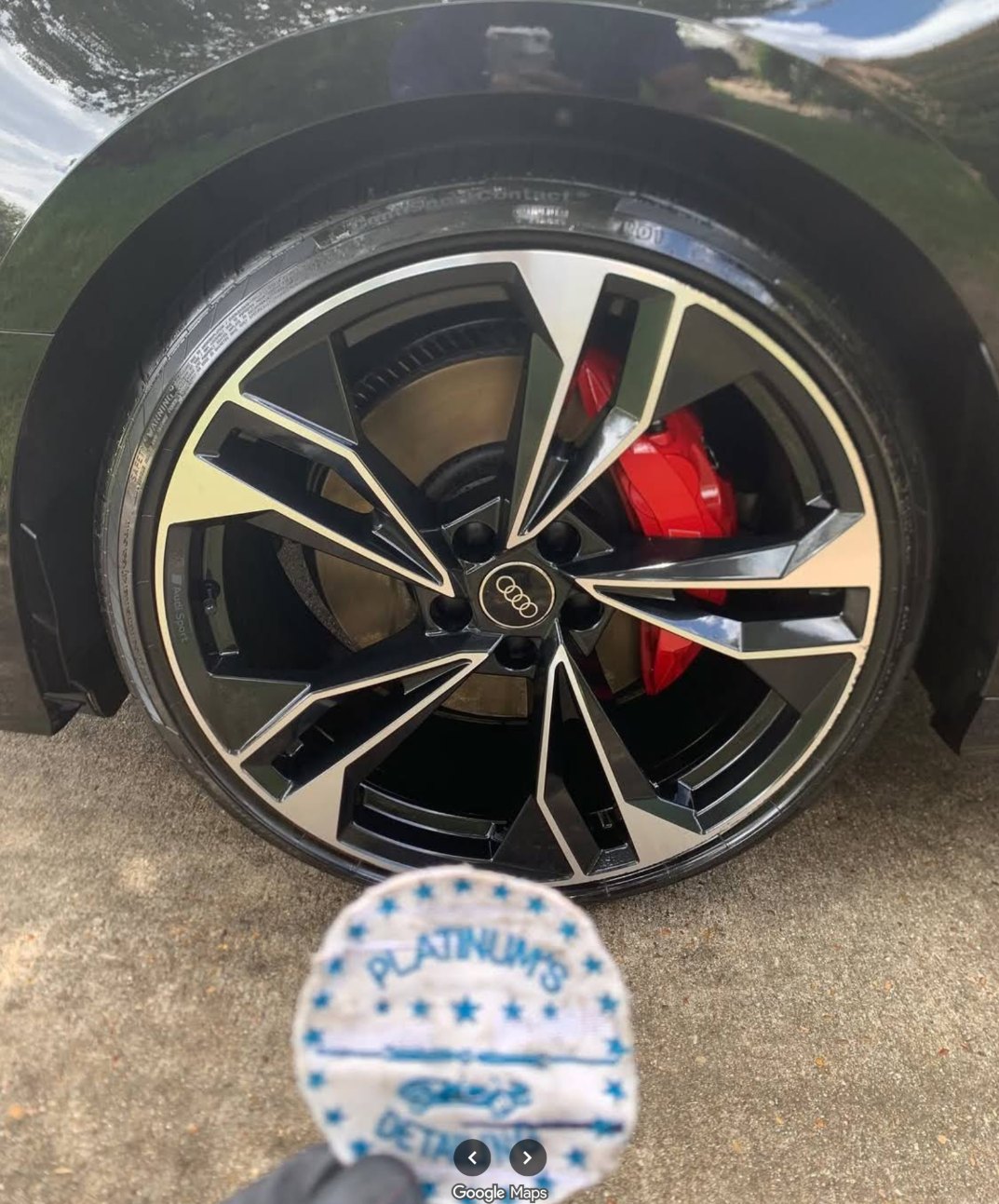 Audi RS wheel and red brake caliper cleaned by Platinums Mobile Detailing