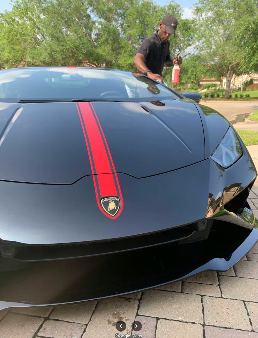 Hand finishing work on a Lamborghini hood