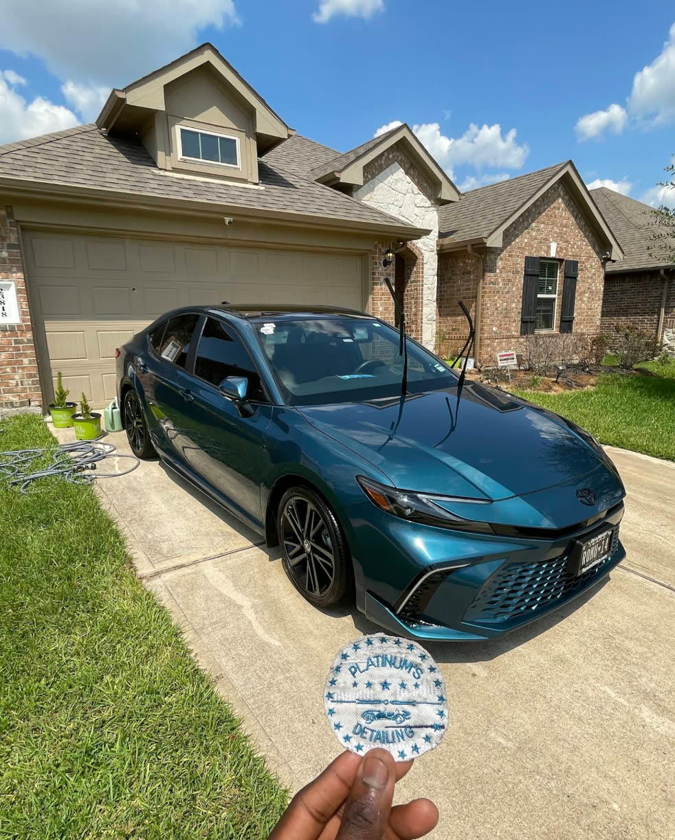 Freshly detailed sedan in a Katy, Texas driveway